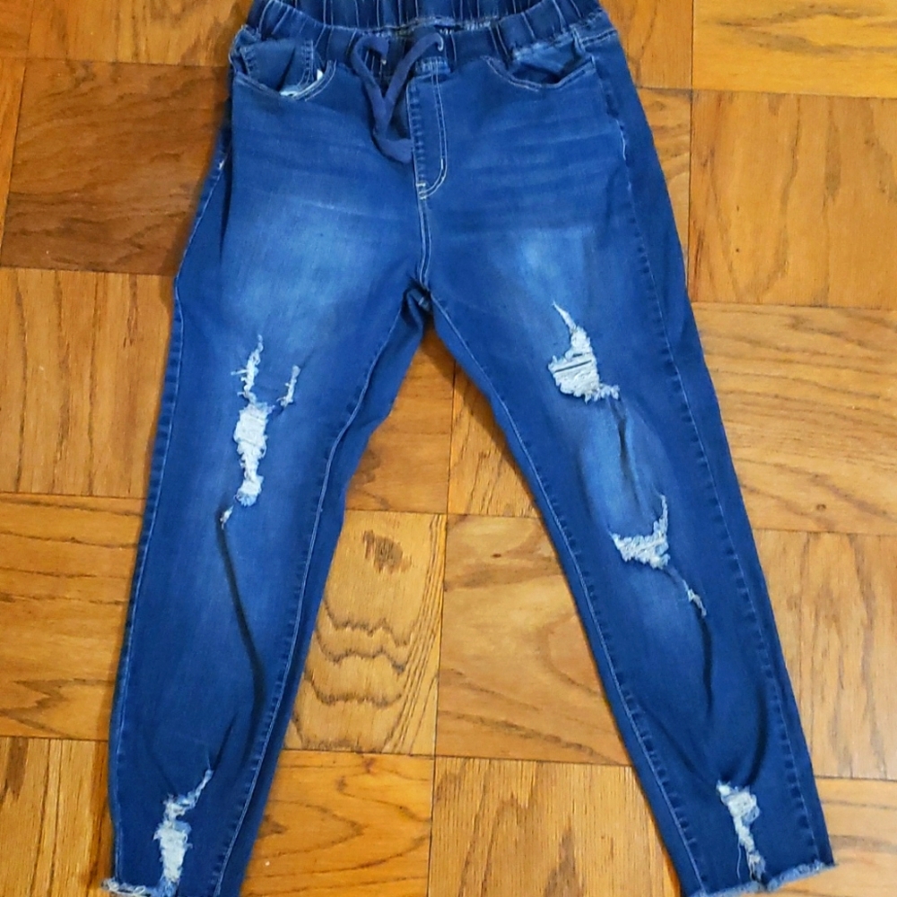 Distressed jeggings.  Elastic drawstring waist.
